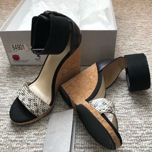 Jimmy Choo
Black Neston Mixed Media Snakeskin Wedge Sandal Pumps.